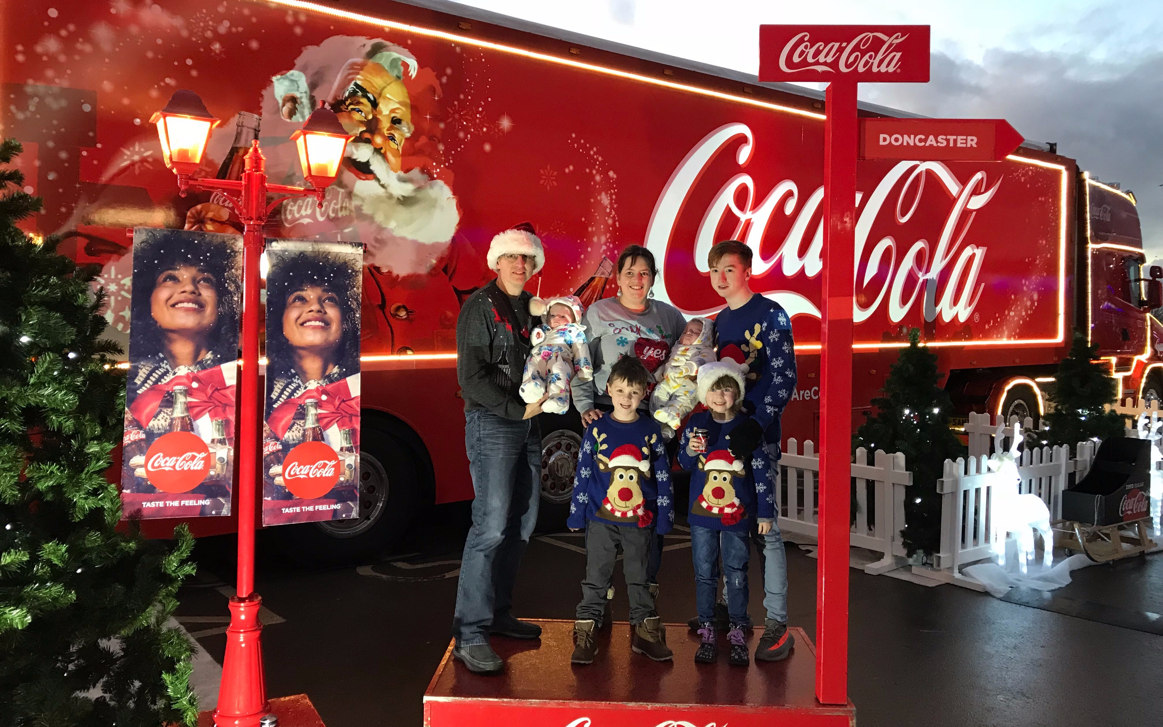 10 Reasons –  Why standing in the queue to have your photo took in front of the Coca-Cola Lorry will break you!